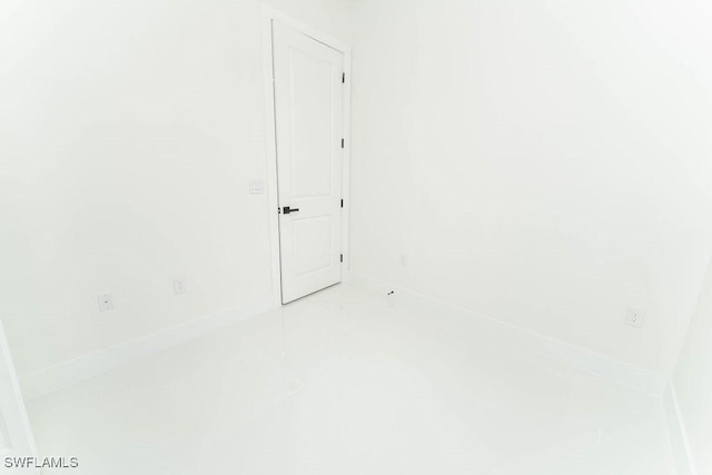 1412 5th Ave, Lehigh Acres, FL 33972 - empty room with tile patterned flooring