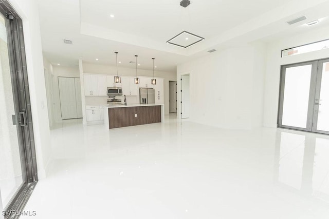 1412 5th Ave, Lehigh Acres, FL 33972 - unfurnished living room featuring recessed lighting and a sink