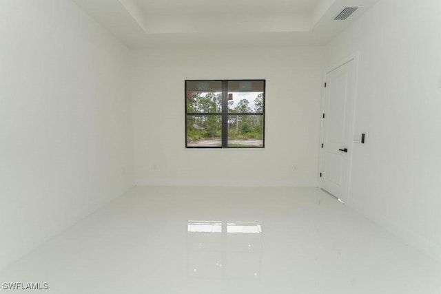 1412 5th Ave, Lehigh Acres, FL 33972 - spare room with a tray ceiling