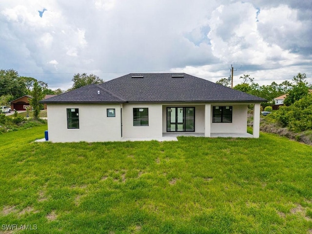 1412 5th Ave, Lehigh Acres, FL 33972 - back of house featuring a patio, stucco siding, and a yard