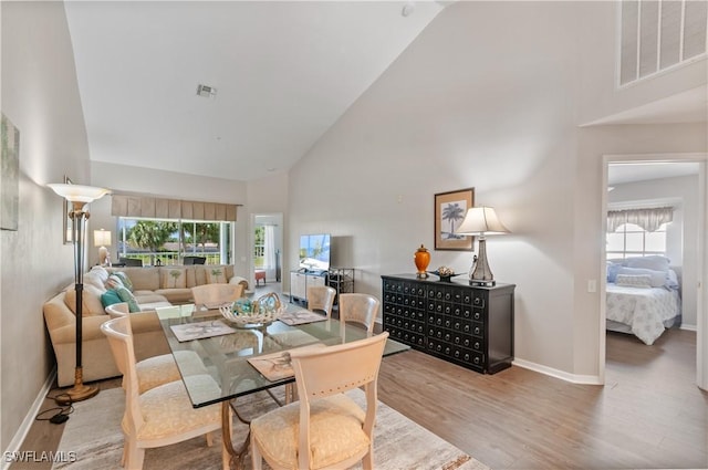 13641 Worthington Way Unit 1612, Bonita Springs, FL 34135 - dining area with high vaulted ceiling and wood finished floors
