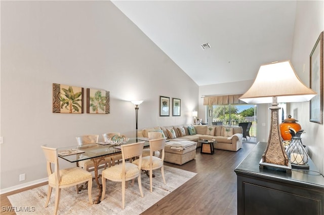 13641 Worthington Way Unit 1612, Bonita Springs, FL 34135 - dining area featuring high vaulted ceiling and wood finished floors