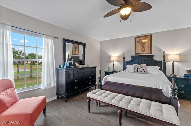 13641 Worthington Way Unit 1612, Bonita Springs, FL 34135 - bedroom featuring multiple windows, wood finished floors, and ceiling fan