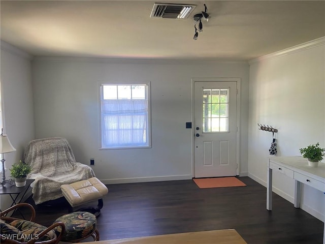 entryway with crown molding, baseboards, visible vents, and dark wood-style floors