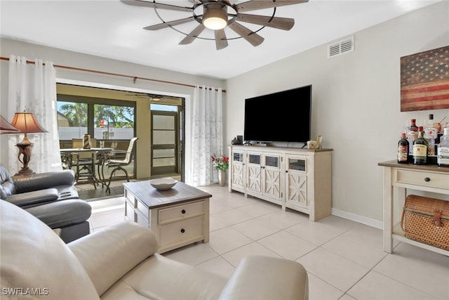 3720 SE 10th Ave Unit 102, Cape Coral, FL 33904 - living room featuring light tile patterned floors, baseboards, a ceiling fan, and visible vents