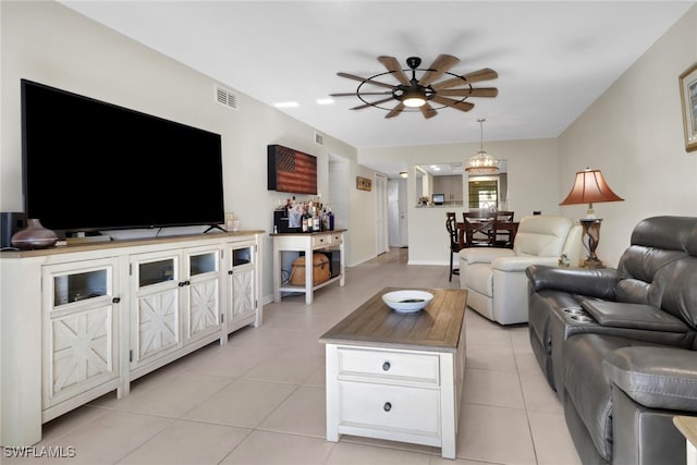 3720 SE 10th Ave Unit 102, Cape Coral, FL 33904 - living room featuring a ceiling fan, baseboards, visible vents, and light tile patterned floors