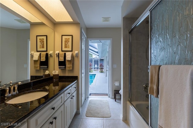 full bathroom with tile patterned flooring, vanity, toilet, visible vents, and bath / shower combo with glass door
