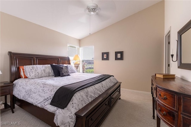 bedroom with light colored carpet, a ceiling fan, baseboards, and lofted ceiling