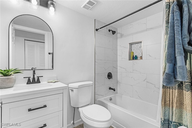 bathroom featuring vanity, toilet, a textured ceiling, bathing tub / shower combination, and visible vents