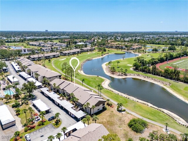 aerial view with a water view, view of golf course, and a residential view