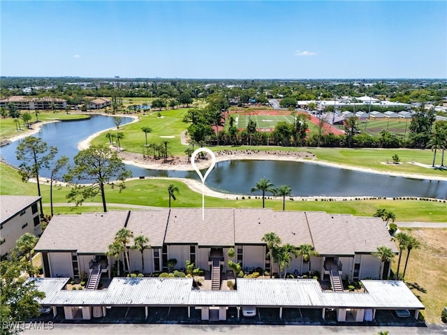 birds eye view of property featuring a water view and golf course view