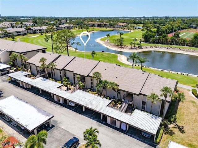 birds eye view of property featuring a residential view, view of golf course, and a water view