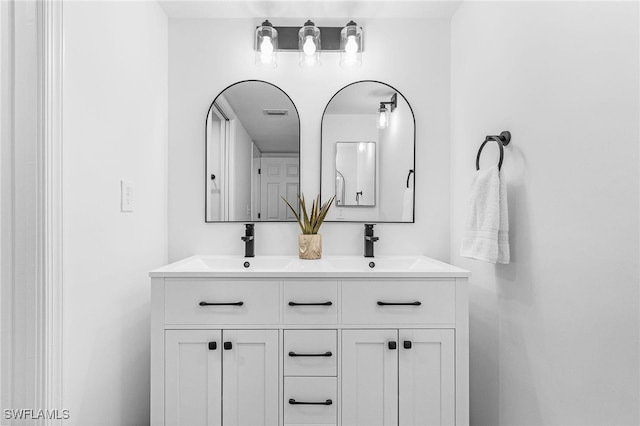 bathroom featuring double vanity and a sink