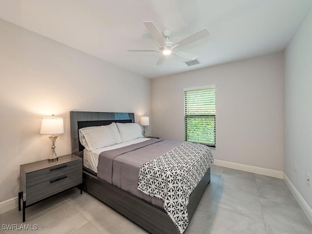 tiled bedroom featuring baseboards, ceiling fan, and visible vents