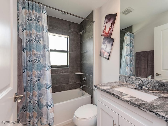 bathroom with vanity, toilet, visible vents, and shower / tub combo with curtain