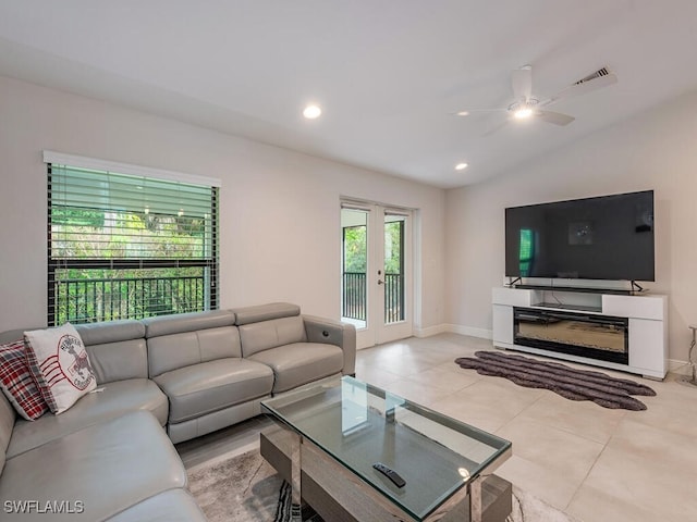 tiled living area featuring french doors, a ceiling fan, baseboards, recessed lighting, and visible vents