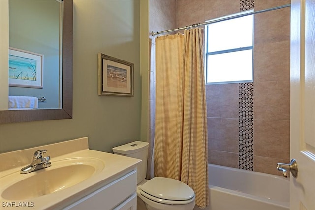 bathroom featuring toilet, vanity, and shower / bath combo