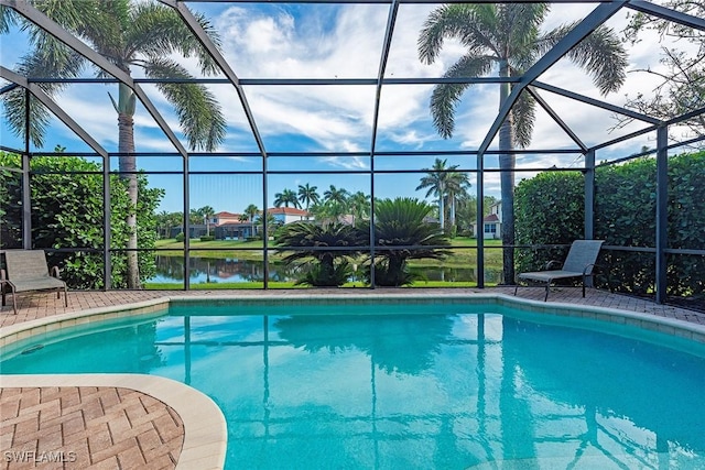 outdoor pool featuring a water view and a lanai