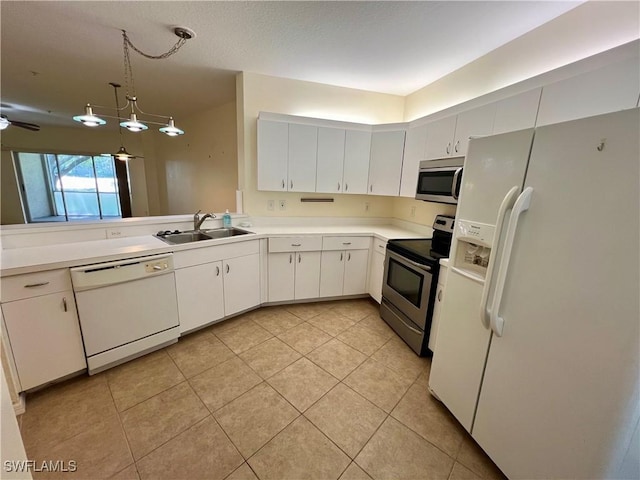 kitchen featuring white cabinetry, a sink, light countertops, stainless steel appliances, and light tile patterned flooring