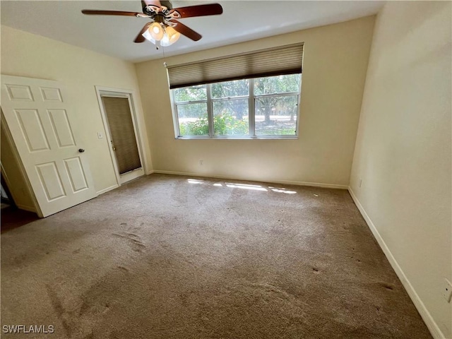 unfurnished bedroom with carpet floors, baseboards, a closet, and ceiling fan