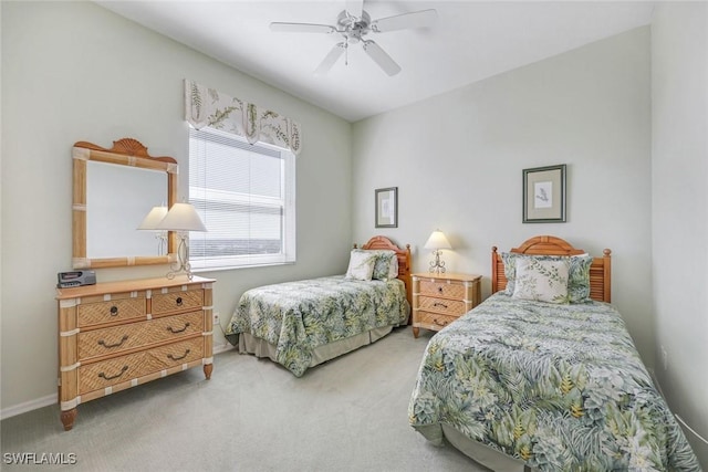 bedroom featuring baseboards, a ceiling fan, and light carpet