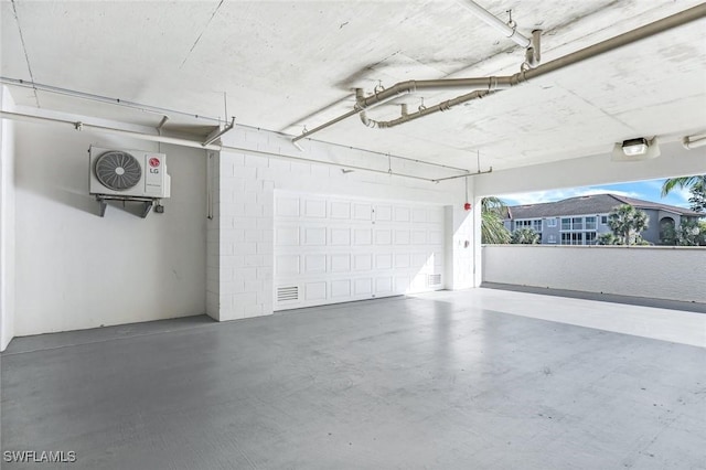 garage featuring ac unit