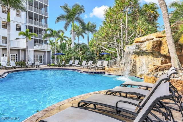 pool featuring a patio and fence