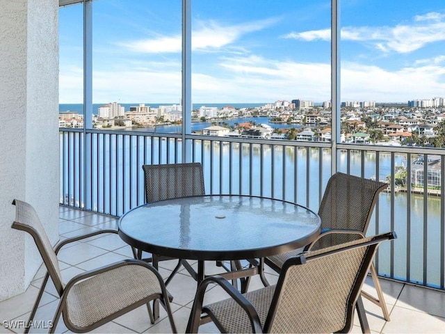 balcony with a water view and a city view