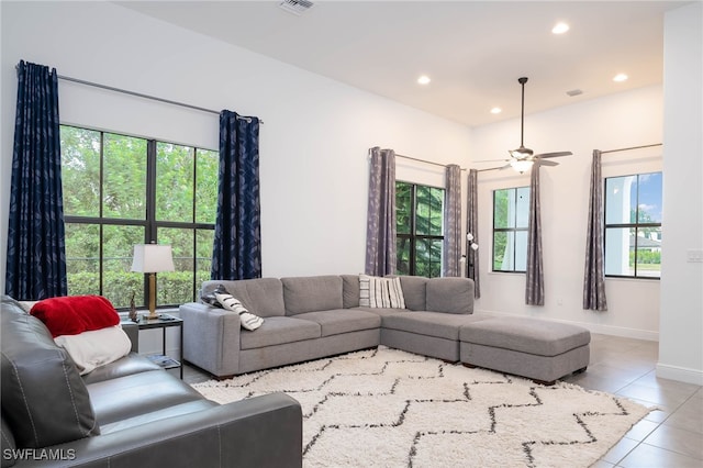 living room with plenty of natural light, recessed lighting, baseboards, and tile patterned floors