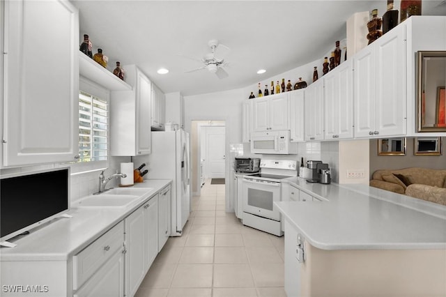 3695 Exuma Way, Naples, FL 34119 - kitchen with ceiling fan, a sink, light tile patterned floors, white appliances, and white cabinetry