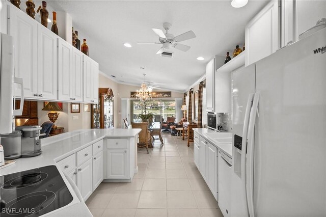 3695 Exuma Way, Naples, FL 34119 - kitchen featuring light countertops, white cabinets, ceiling fan with notable chandelier, and white appliances