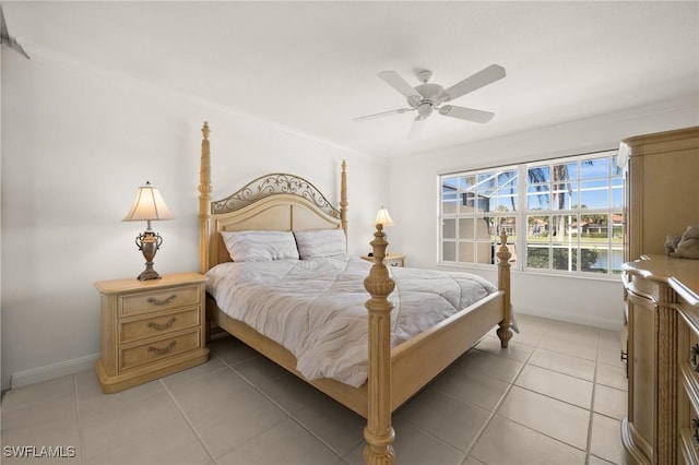 3695 Exuma Way, Naples, FL 34119 - bedroom with a ceiling fan, baseboards, ornamental molding, and light tile patterned floors