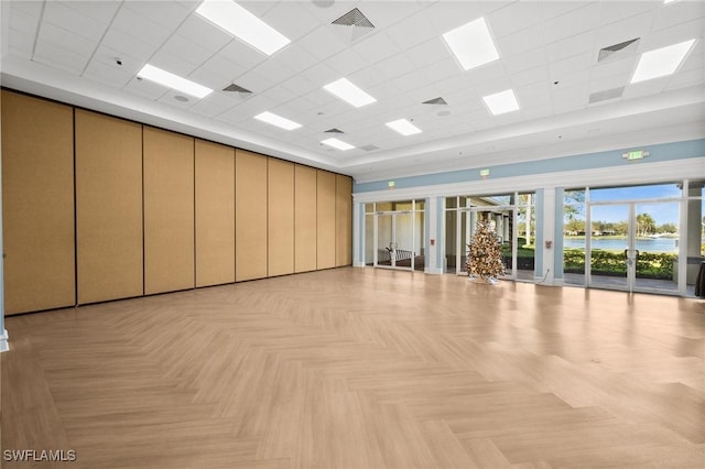 3695 Exuma Way, Naples, FL 34119 - exercise area featuring a water view, a paneled ceiling, and a towering ceiling