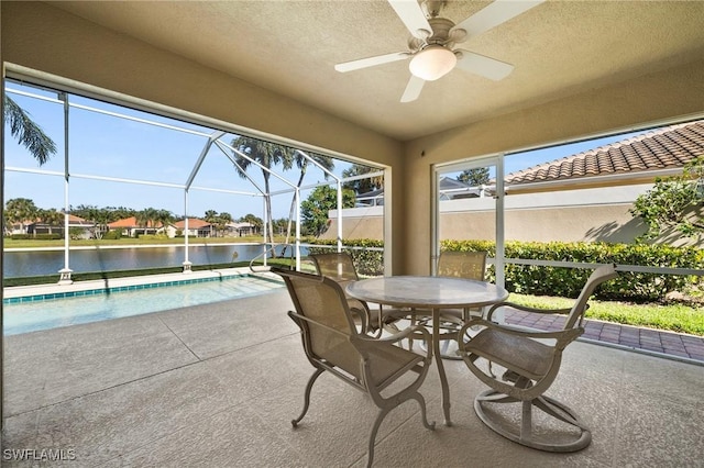 3695 Exuma Way, Naples, FL 34119 - exterior space featuring an outdoor pool, a ceiling fan, a water view, glass enclosure, and outdoor dining space