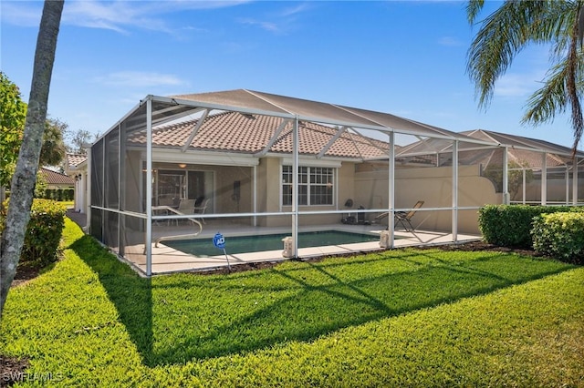 3695 Exuma Way, Naples, FL 34119 - back of property with glass enclosure, a patio area, an outdoor pool, and a yard