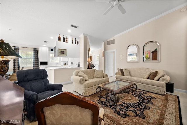 3695 Exuma Way, Naples, FL 34119 - living area with crown molding, a ceiling fan, baseboards, vaulted ceiling, and visible vents