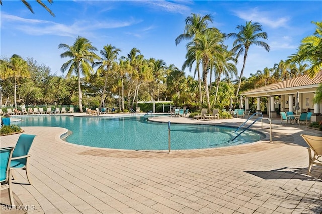 3695 Exuma Way, Naples, FL 34119 - community pool featuring a patio area