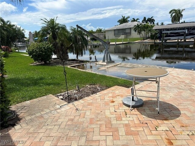 12 Bayview Blvd, Fort Myers Beach, FL 33931 - exterior space featuring a lawn and a water view