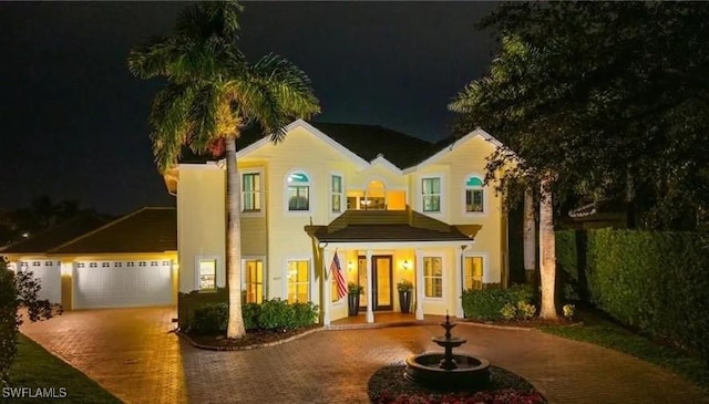 4009 Treadwater Ct, Naples, FL 34109 - view of front facade with curved driveway and stucco siding