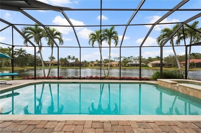4009 Treadwater Ct, Naples, FL 34109 - outdoor pool with a water view, a lanai, an in ground hot tub, and a patio