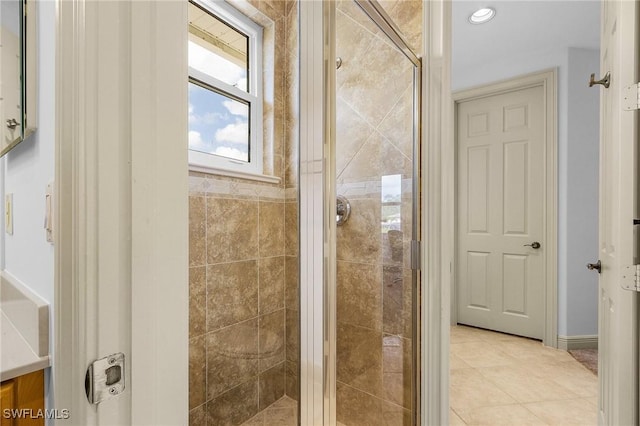 4009 Treadwater Ct, Naples, FL 34109 - bathroom with tile patterned flooring and a stall shower