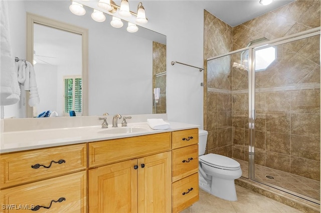 4009 Treadwater Ct, Naples, FL 34109 - full bath featuring vanity, tile patterned floors, a shower stall, and toilet
