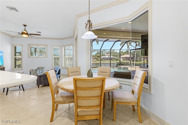 4009 Treadwater Ct, Naples, FL 34109 - dining space featuring ceiling fan, visible vents, a sunroom, ornamental molding, and light tile patterned flooring