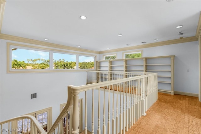4009 Treadwater Ct, Naples, FL 34109 - hall with visible vents, ornamental molding, wood finished floors, recessed lighting, and an upstairs landing