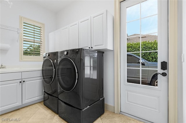 4009 Treadwater Ct, Naples, FL 34109 - laundry area with light tile patterned floors, plenty of natural light, cabinet space, and independent washer and dryer