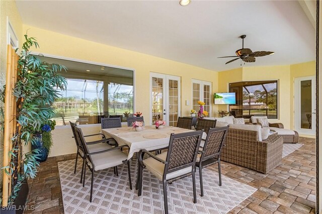 4009 Treadwater Ct, Naples, FL 34109 - dining space featuring ceiling fan, stone finish floor, and french doors