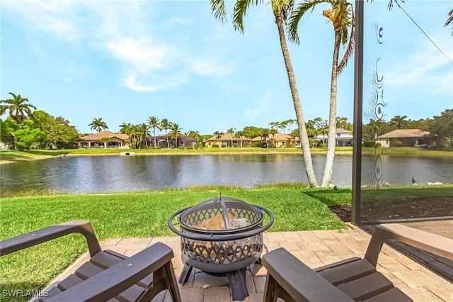 4009 Treadwater Ct, Naples, FL 34109 - view of patio / terrace featuring a water view, an outdoor fire pit, and a residential view