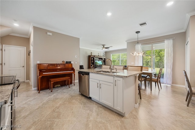 kitchen with light stone counters, a sink, white cabinetry, crown molding, and stainless steel appliances