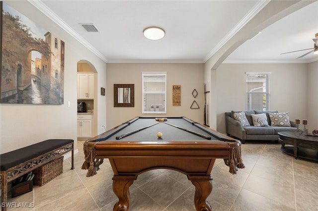 rec room with arched walkways, ornamental molding, light tile patterned floors, and visible vents
