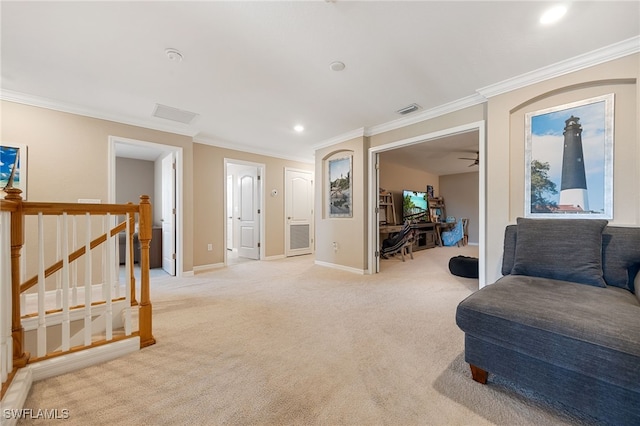living area featuring crown molding, light colored carpet, baseboards, and visible vents